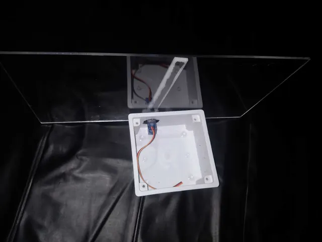 OLED wired to a microcontroller mid-test on a breadboard